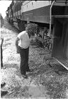 Train engineer pointing to where a baby was pulled from beneath a Southern Railway freight train